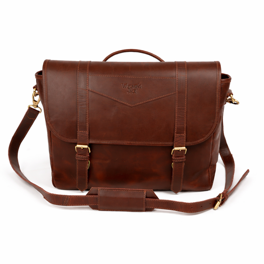 Wyoming Jack Trail Boss leather messenger bag with carry handle, featuring a rugged design and adjustable strap for everyday use.
