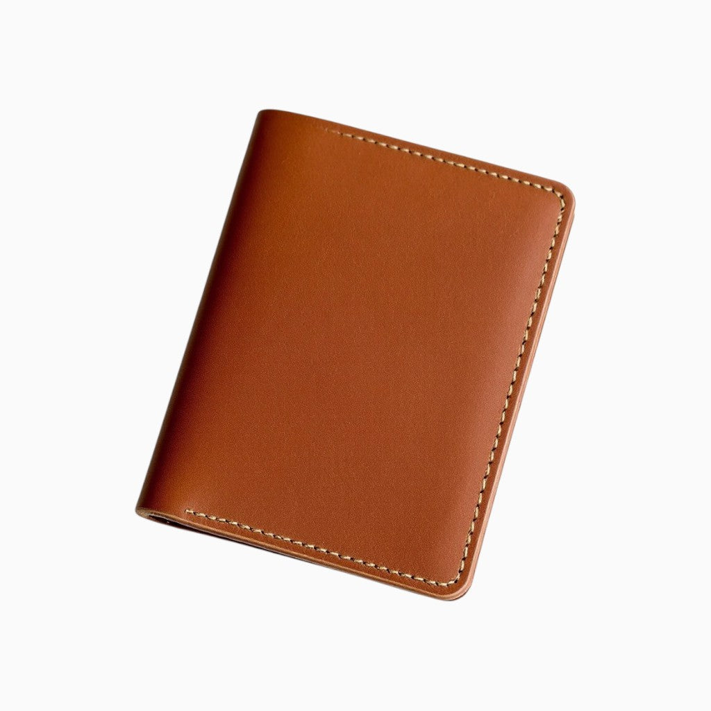 Wyoming Jack full-grain leather slim wallet in a rich tan color with neat stitching