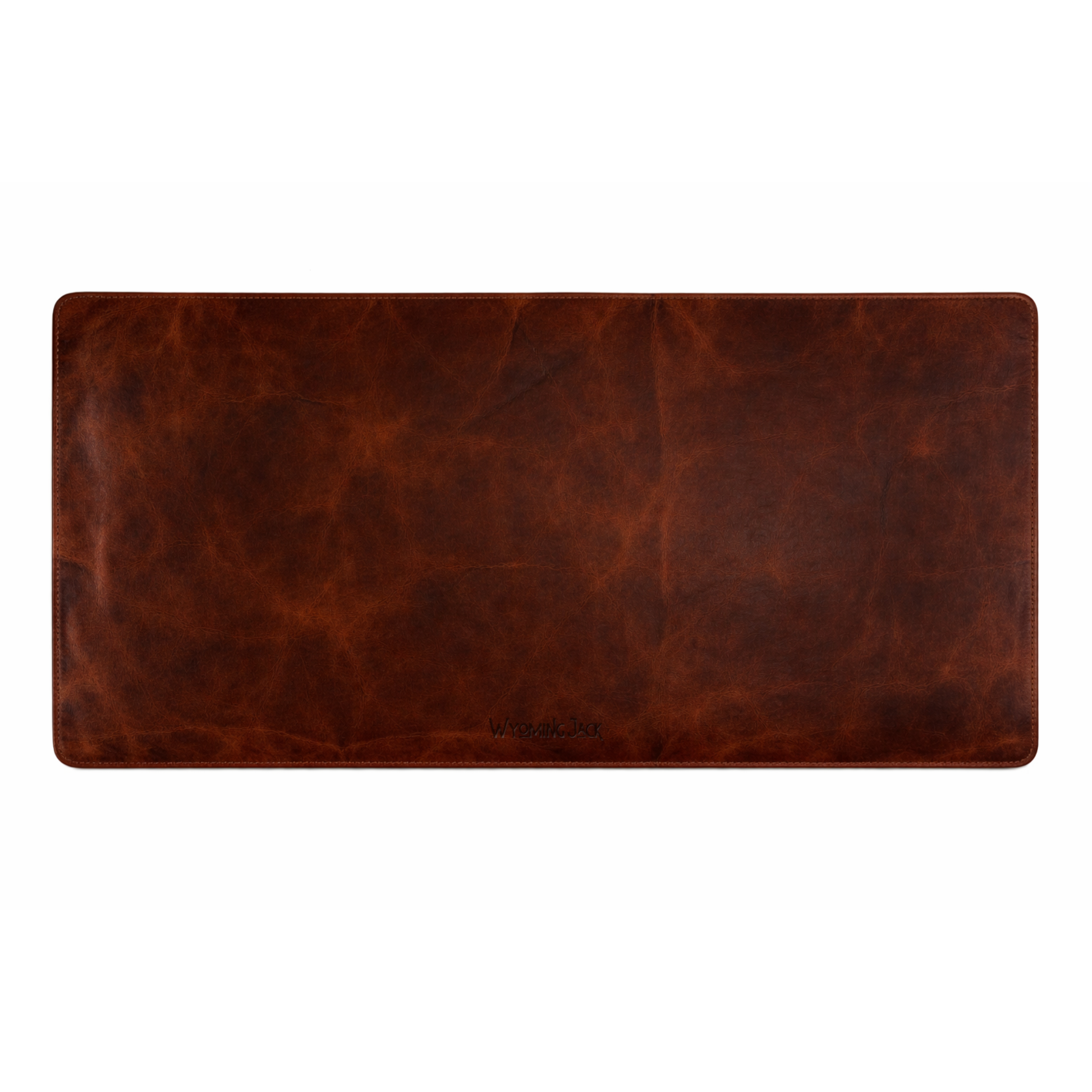 Wyoming Jack Frontier leather desk pad showing a smooth, brown leather surface on a tidy desk for increased workspace and protection