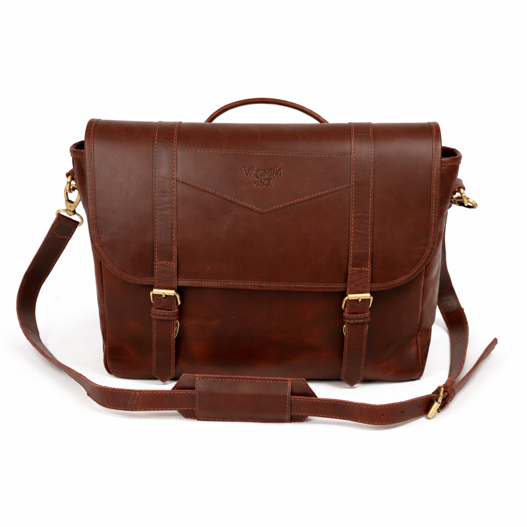 Wyoming Jack Trail Boss leather messenger bag with carry handle, featuring a rugged brown leather design and adjustable strap.