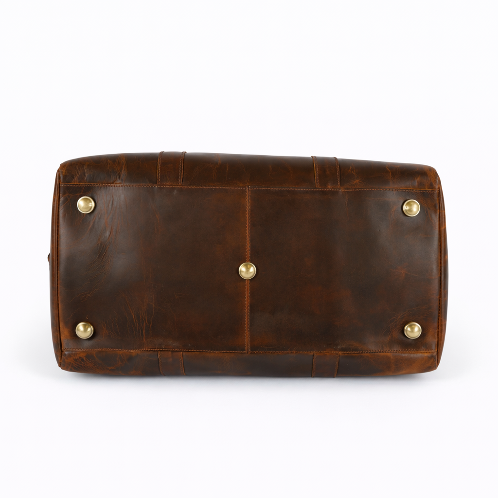 Wyoming Jack Trail Boss Leather Duffle Bag in Brandy with sturdy leather construction and reinforced bottom for travel.
