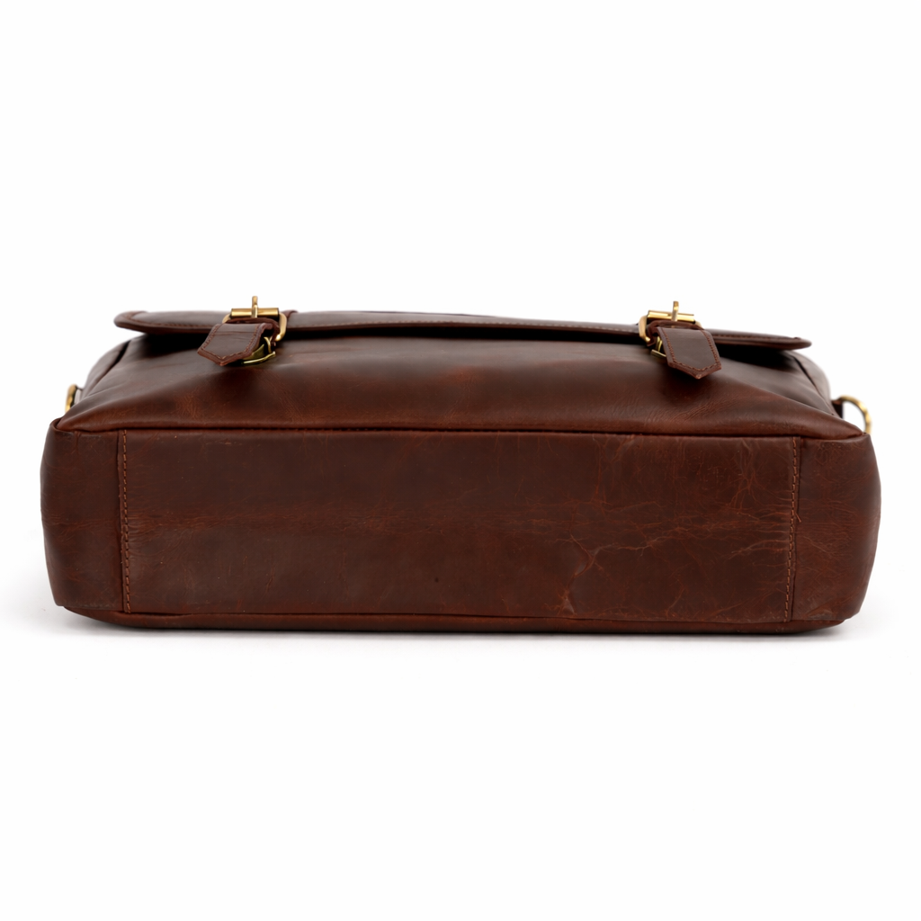 Wyoming Jack Trail Boss leather messenger bag with carry handle, shown from bottom view, durable brown leather design.