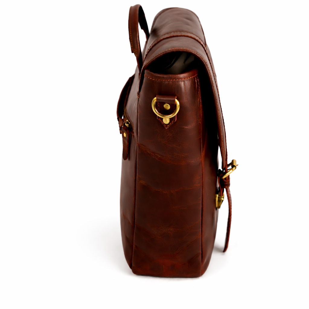 Side view of Wyoming Jack Trail Boss leather messenger bag with carry handle, showcasing its rugged design and sturdy construction.