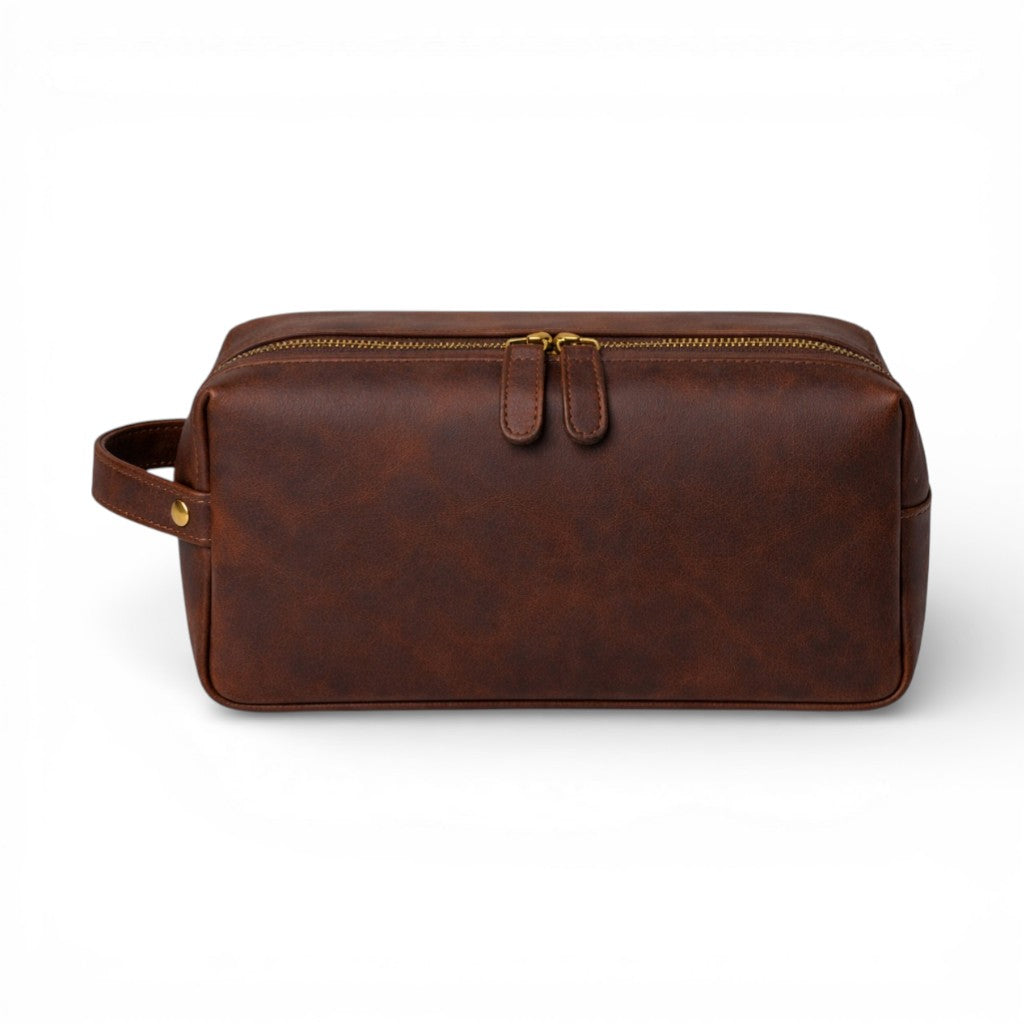 Brown full-grain leather Dopp Kit by Wyoming Jack, featuring a zip closure and personalized customization.