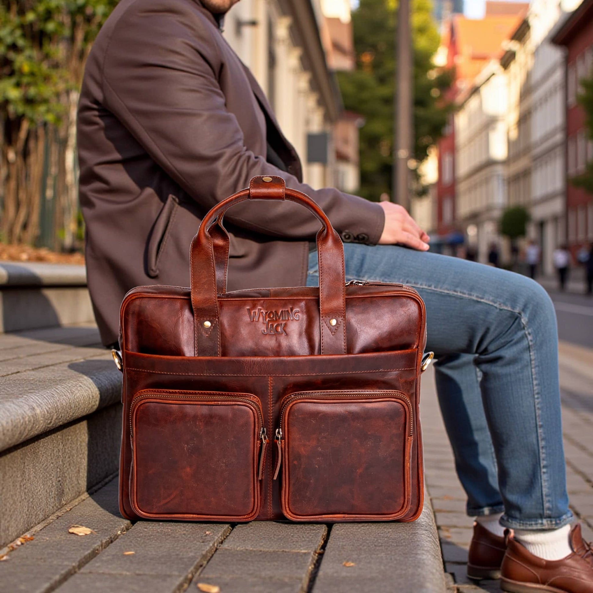 Wyoming Jack Frontier leather briefcase with sturdy handle, front pocket, and classic design for professional use