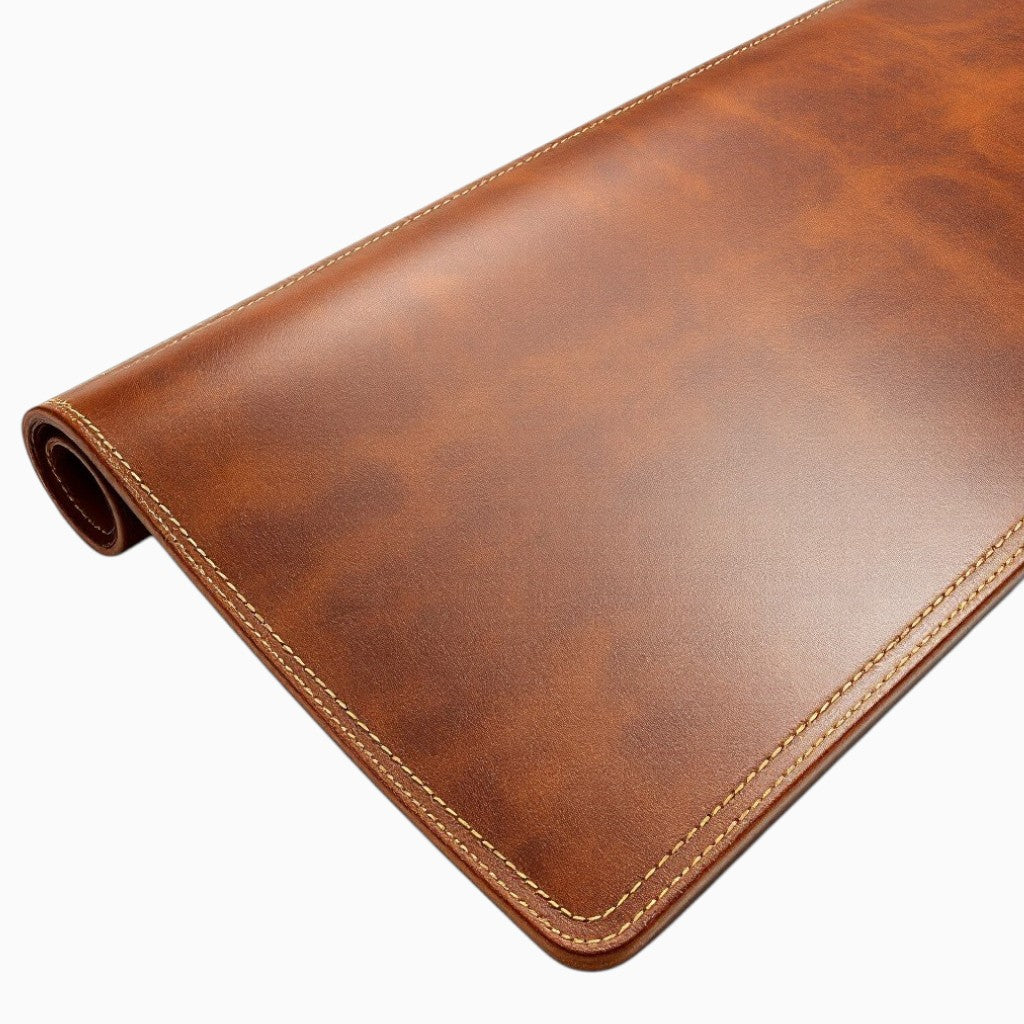 Wyoming Jack leather desk pad, personalized and custom, showing smooth brown leather surface on a modern office desk.