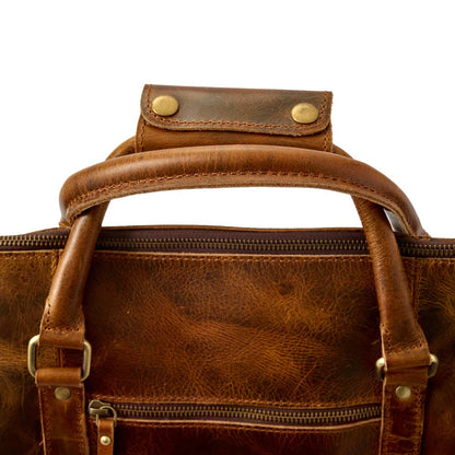 Wyoming Jack Badlands Leather Duffle Bag, 20-inch carry-on with sturdy leather exterior and padded handles for travel.