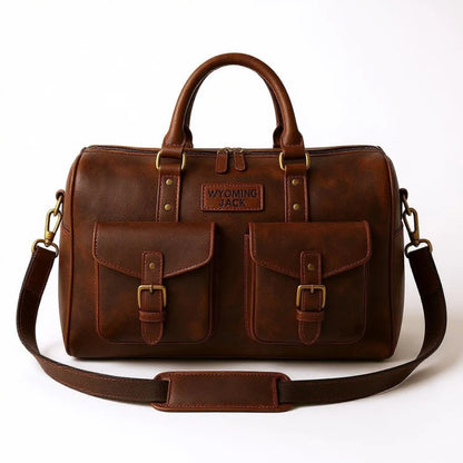 Wyoming Jack Expedition Leather Duffle Bag with custom personalized leather strap and spacious interior for travel.