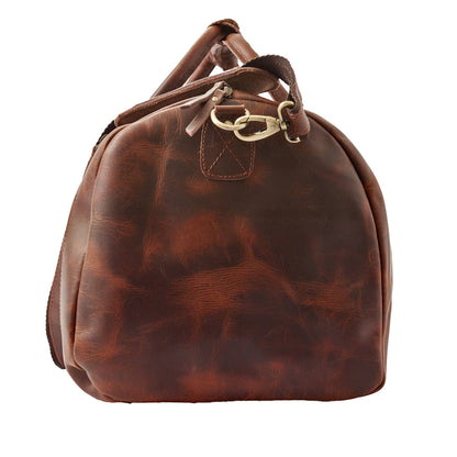 Wyoming Jack Badlands leather duffle bag with shoe compartment, rugged design, and sturdy handles for travel and weekend trips.