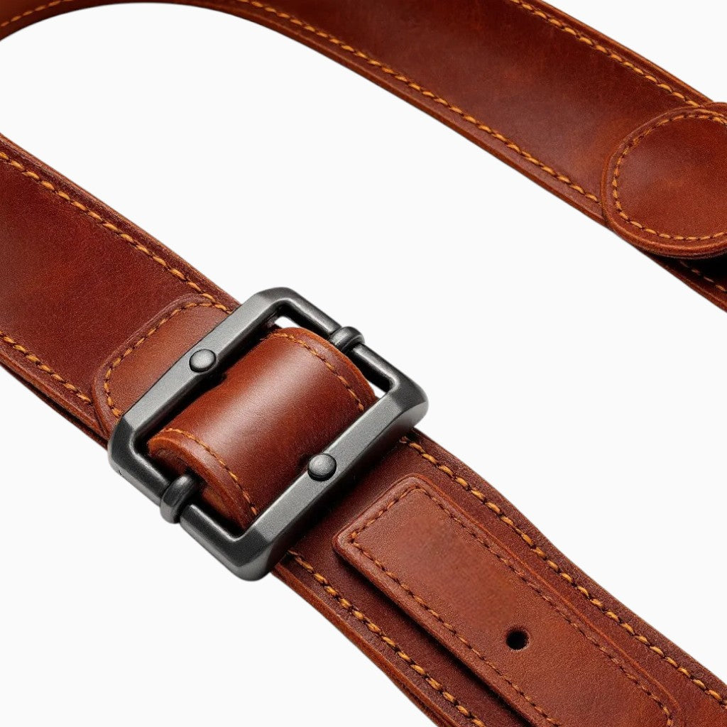 Leather gun sling by Wyoming Jack with custom personalization, featuring durable leather and adjustable straps for secure carry.