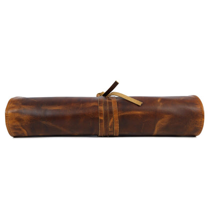 Leather knife roll by Wyoming Jack holding six knives, customizable and personalized for secure storage and easy transport.