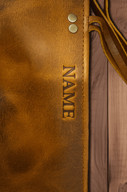 Wyoming Jack leather knife roll with custom personalization, designed to hold six knives securely, featuring a durable brown leather exterior.
