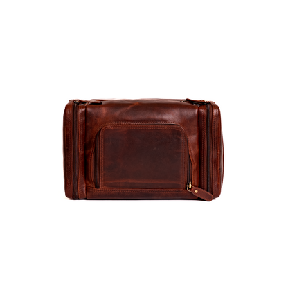 Wyoming Jack Frontier leather toiletry bag for travel, featuring a sleek brown leather design with zipper closure and handle.