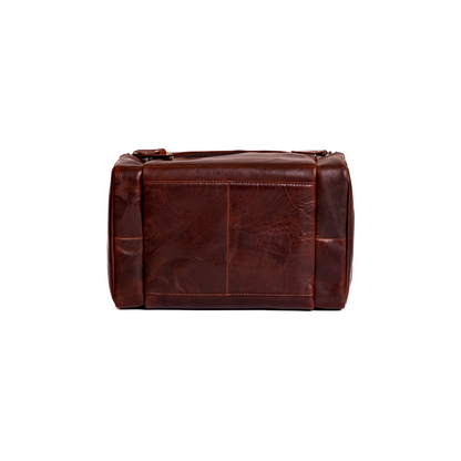 Wyoming Jack Frontier leather toiletry bag for travel, showing front view with zipper and leather handle detail.