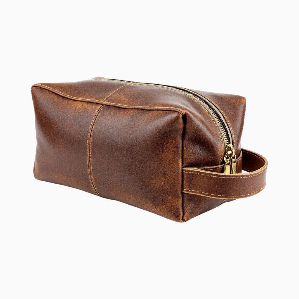 Leather toiletry bag by Wyoming Jack with personalized customization, featuring durable leather material and compact design.